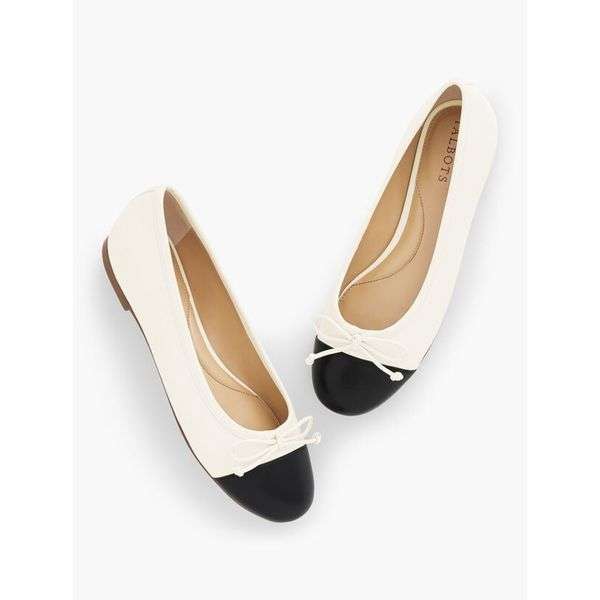 white and black ballet flats